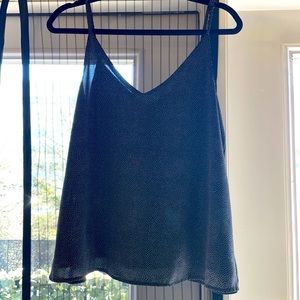 Black and white polkadot silk top. Adjustable straps.